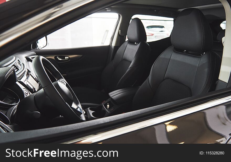 Luxury car Interior - steering wheel, shift lever, dashboard and computer