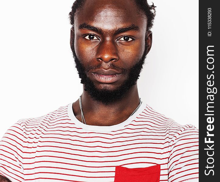 Young handsome afro american boy stylish hipster gesturing emotional isolated on white background smiling, people lifestyle concept close up