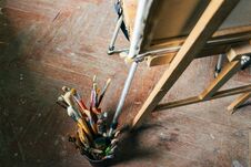Brushes For Drawing On An Old Wooden Easel, Stand On The Floor Stock Image