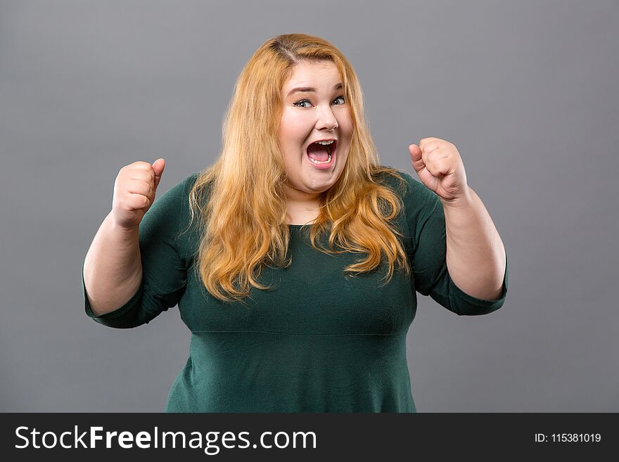 Overwhelmed by emotions. Pleasant emotional woman looking at you while being overwhelmed by emotions