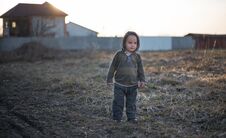 The Little Two-year-old Boy Stands On The Earth Stock Images