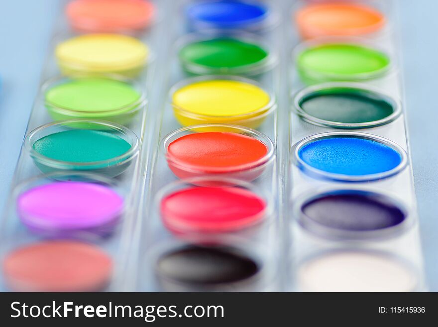 Closeup of bright colorful watercolor paints