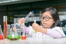Scientist Girl Making Experiment With Test Tube Stock Image