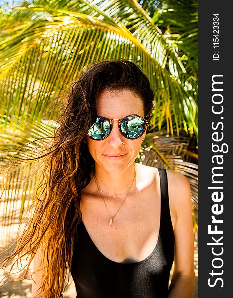 Photography Of A Woman Wearing Sunglasses