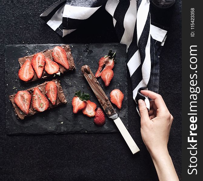 Slices Strawberries On Chopping Board