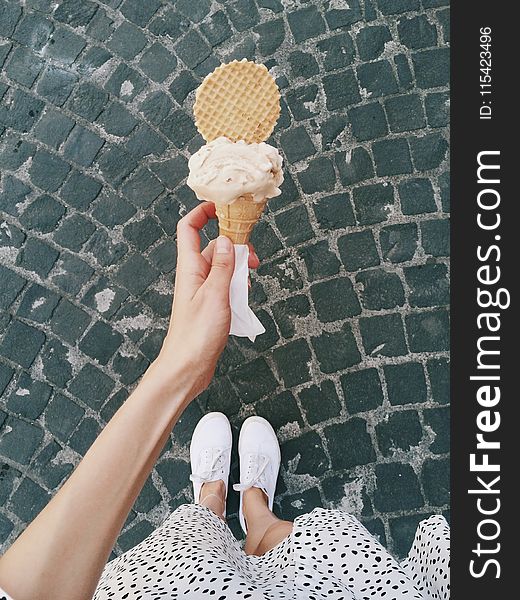 Person Holding Ice Cream in Cone