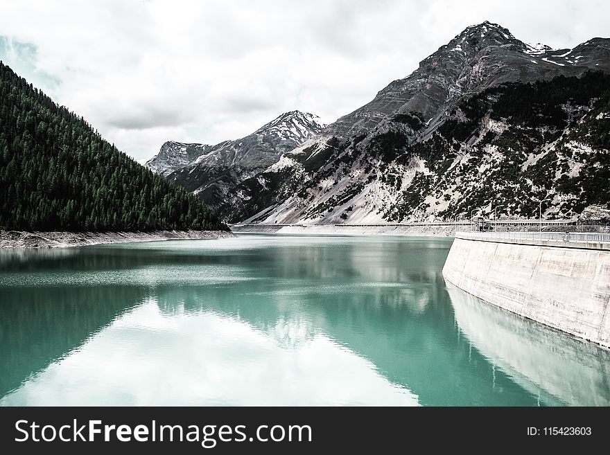 Landscape Photography of Body of Water Near Mountain