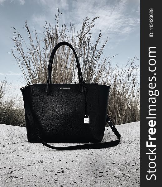Black Michael Kors Leather 2-way Bag on Gray Surface