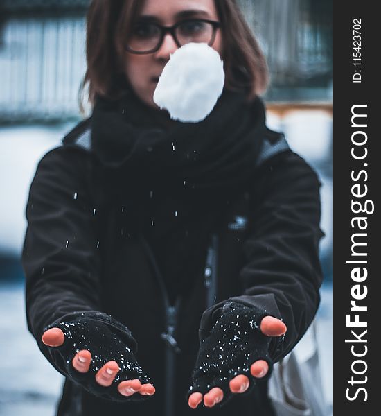 Woman Wearing Black Jacket Holding White Snow