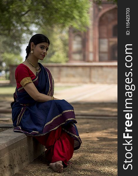 Woman Wearing Blue And Red Dress