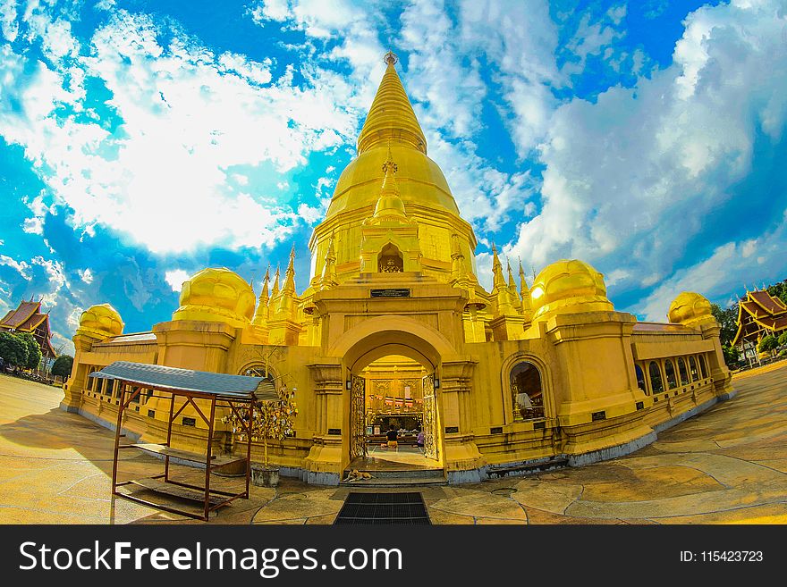 Gold Temple Under Cloudy Sky
