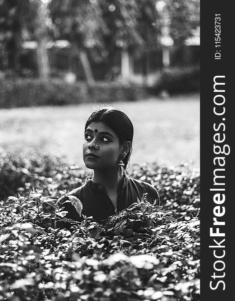 Grayscale Photography of Woman on Garden