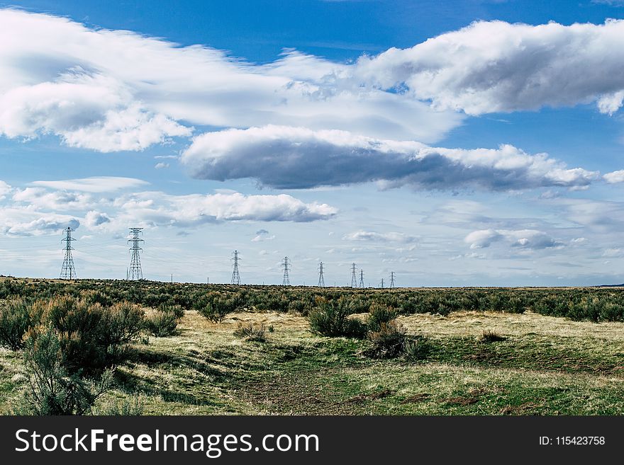 Green Grass Under Blue Sky At Daytime