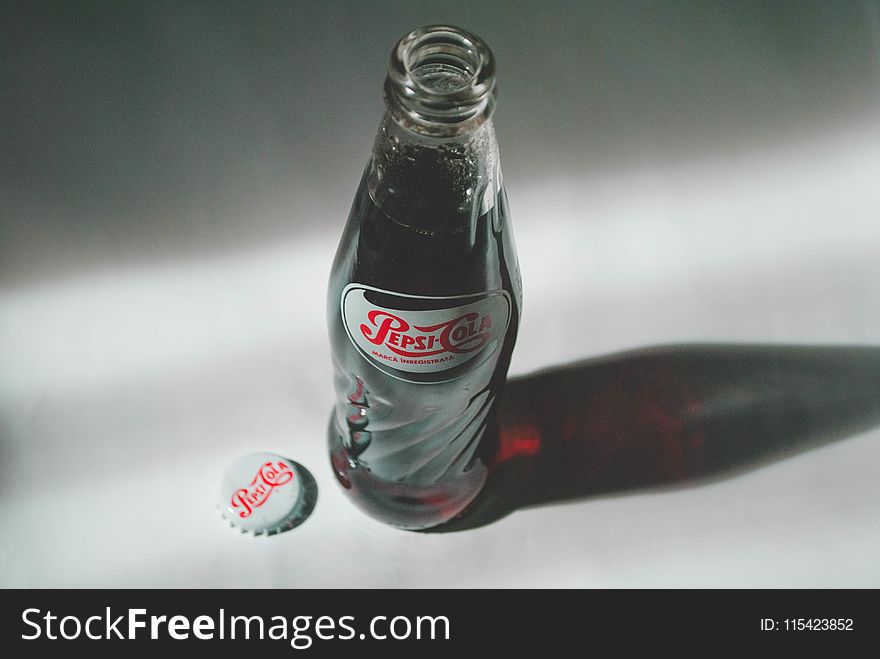 Pepsi-cola Soda Bottle on White Surface