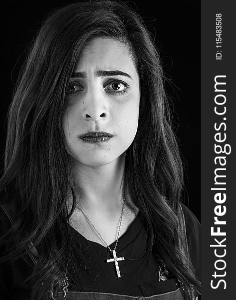 Monochrome Photography of Woman Wearing Cross Necklace