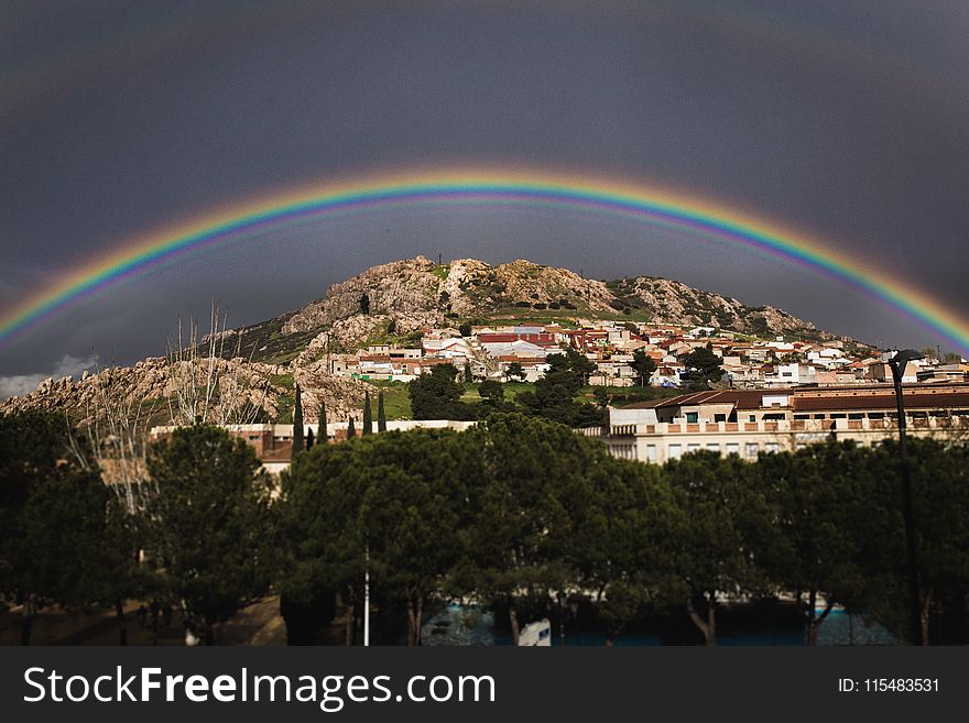 Landscape Photo of the View of City With Rainbow Above