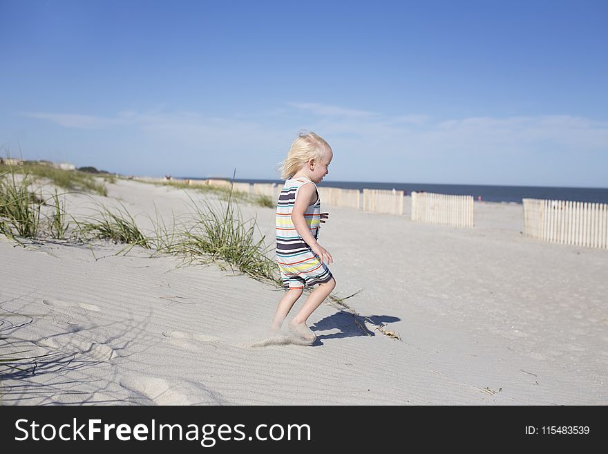 Photography of a Child on Beach