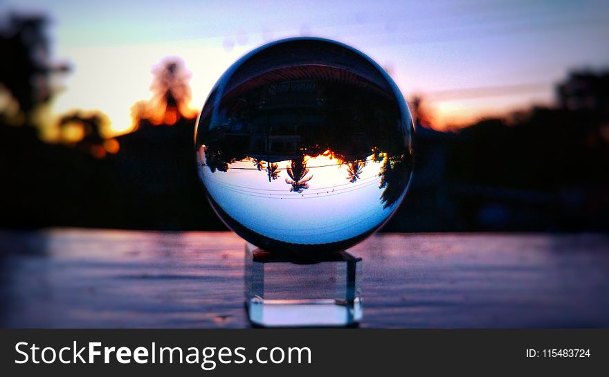 Selective Focus Photo of Clear Glass Ball