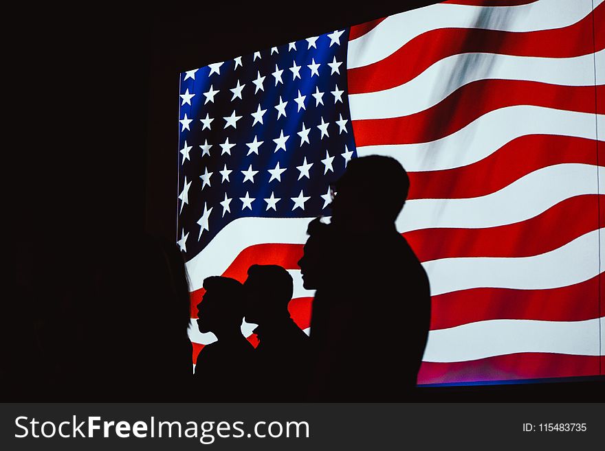 Silhouette of Four Person With Flag of United States Background