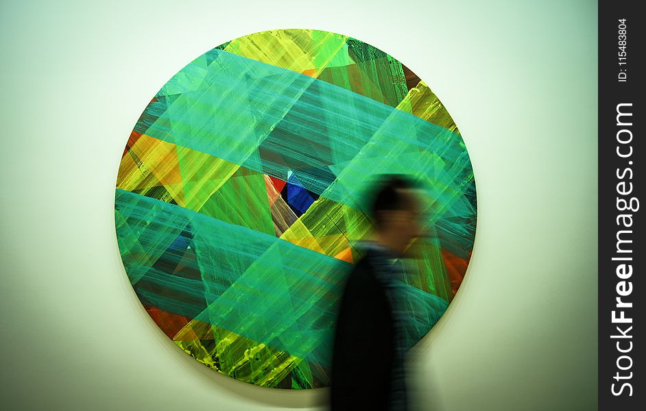Man Passing by Multicolored Art