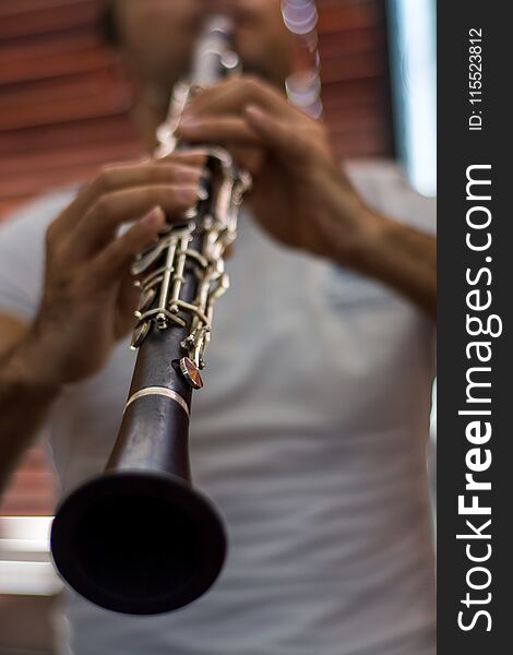 Young man playing the clarinet