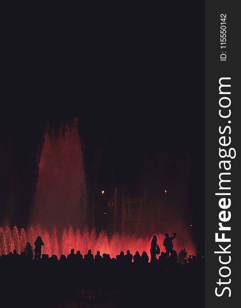 Silhouette Of People Near Fountain