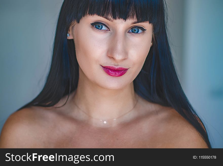 Photo Of Woman With Blue Eyes And Black Hair