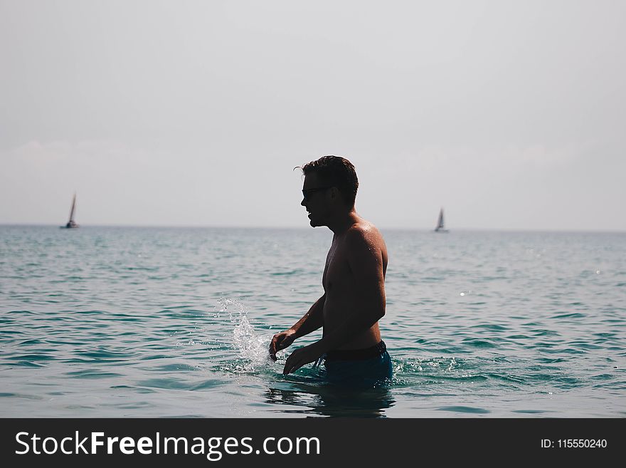 Photography of a Man in Ocean