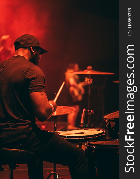 Man&#x27;s Wearing Black Shirt Playing Drum