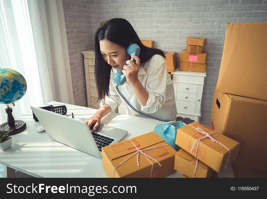 Woman Holding Gray Laptop Computer