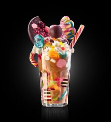 Monster Shake, Freak Caramel Shake Isolated. Colourful, Festive Milk Shake Cocktail With Sweets, Jelly. Colored Caramel Royalty Free Stock Image