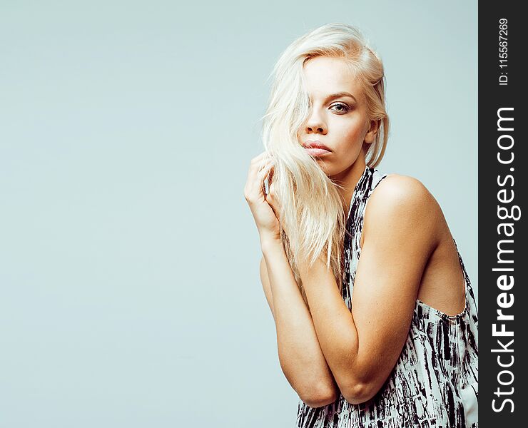 Young pretty stylish blond hipster girl posing emotional on white background happy smiling cool smile, lifestyle people concept close up. Young pretty stylish blond hipster girl posing emotional on white background happy smiling cool smile, lifestyle people concept close up