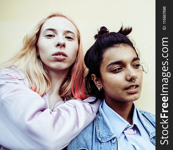 Two teenage girls infront of university building smiling, having fun traveling europe, lifestyle people concept close up