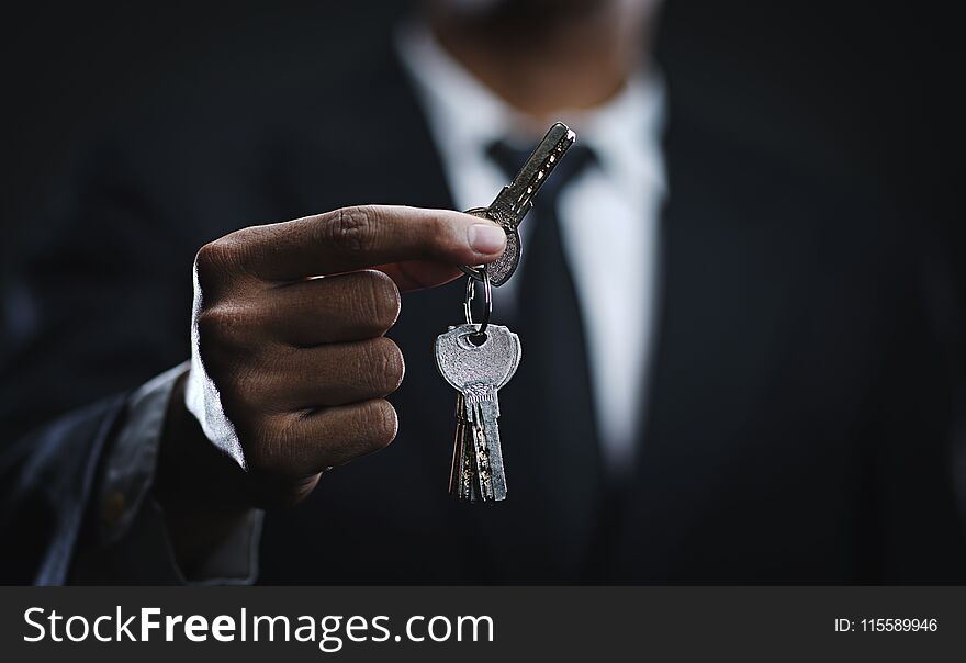 Asian Businessman Holding Keys