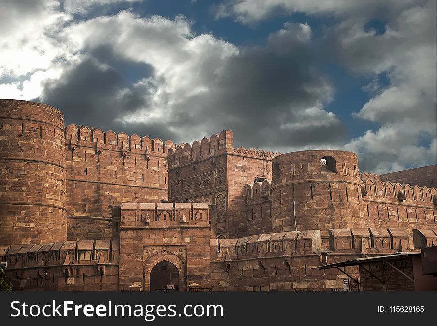 Photo Of Castle Under Clouds