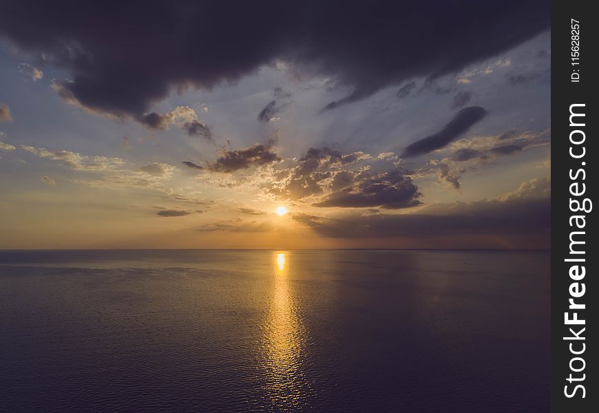 Scenic View of Ocean During Sunset