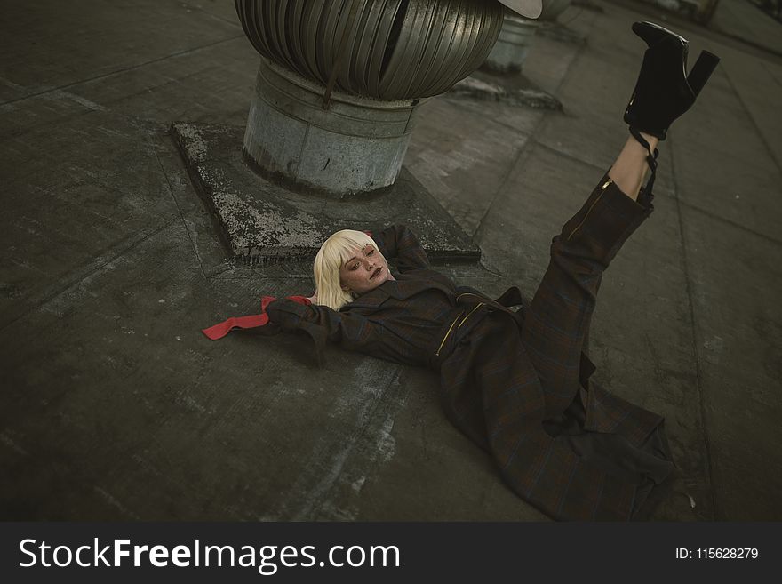 Photo of Woman Laying Down on Floor