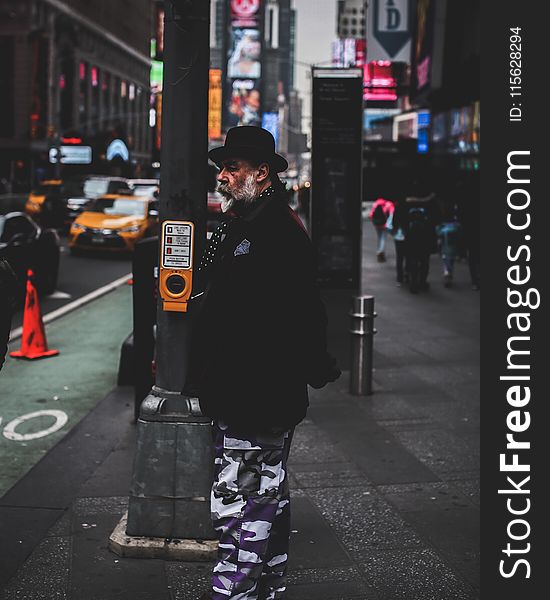 Photo Of Man Standing In The Street