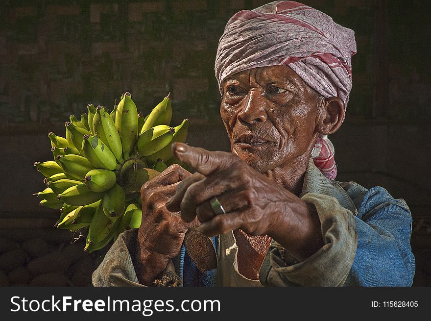 Woman Holding Bananas Figurine