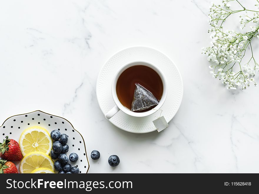 Flat Lay Photography Of Tea In White Teacup With Saucer