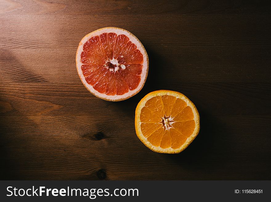 Two Sliced Citrus Fruits