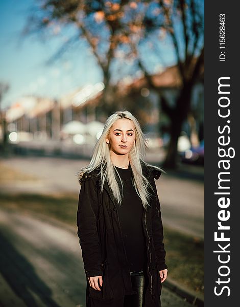 Woman Wearing Black Full-zip Coat Standing Near Green Tree