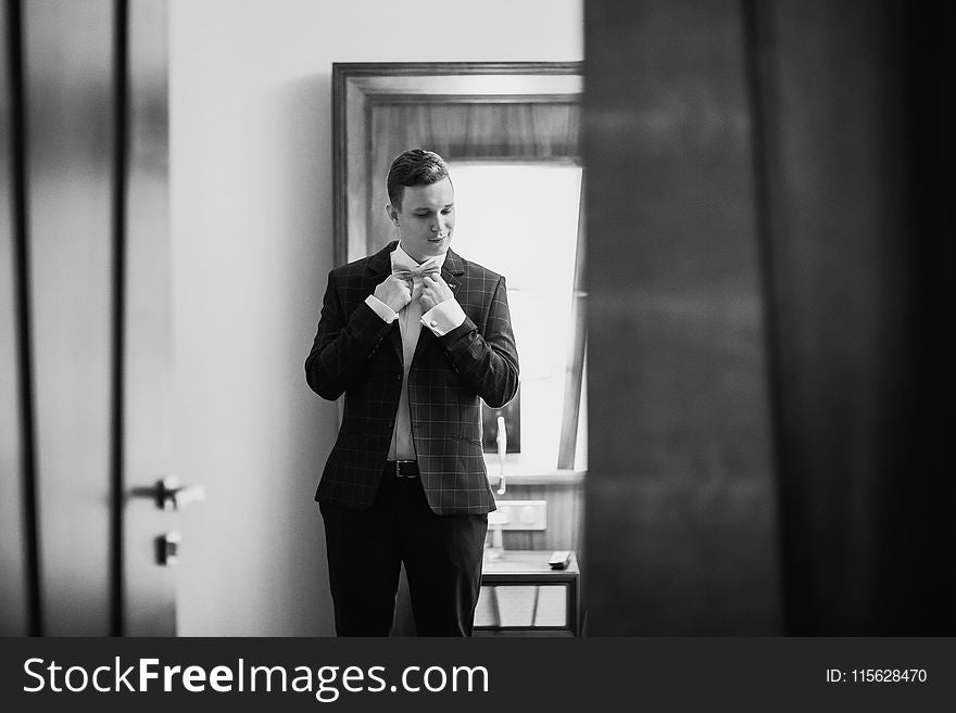 Grayscale Photography of a Man in Formal Suit Jacket