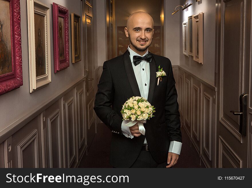 Glamour young husband in a black tuxedo. Glamour young husband in a black tuxedo