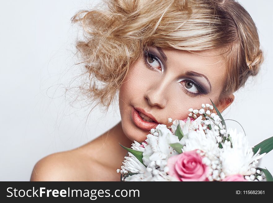 Emotional portrait of beautiful woman with bridal bouquet