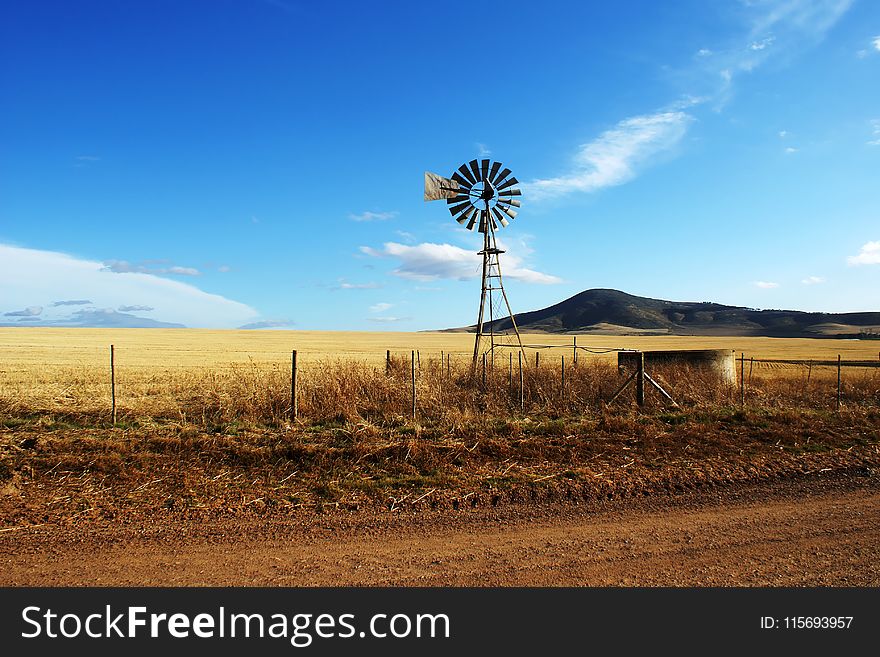 Brown and Black Wooden Wind Mill