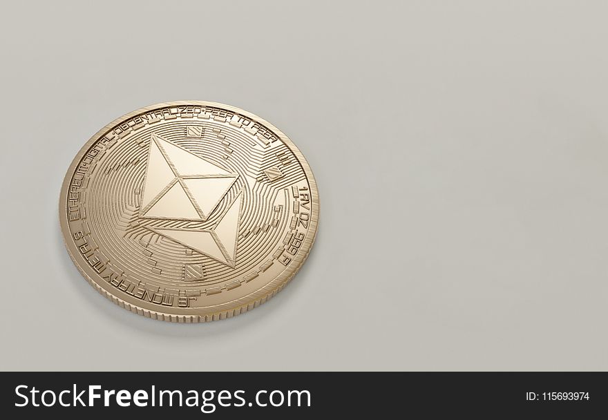 Round Gold-colored Ethereum Coin