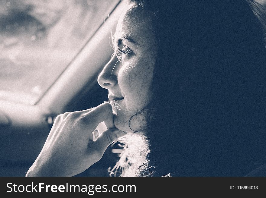 Grayscale Photo Of Woman Inside Vehicle