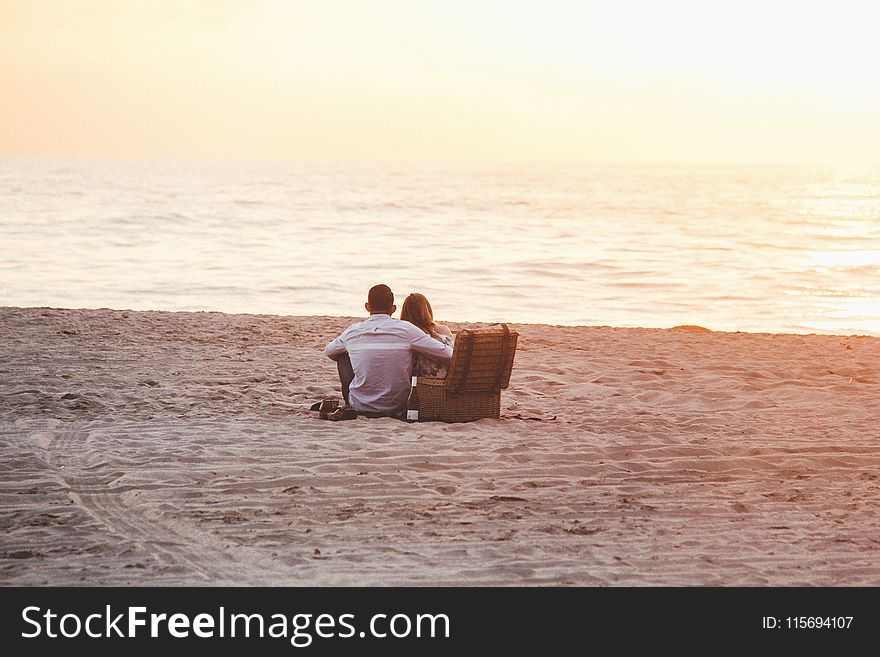Couple at Beach Near Cooler