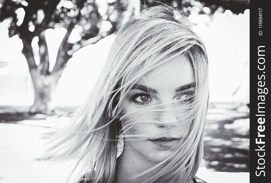 Grayscale Photo Of Woman Near Tree